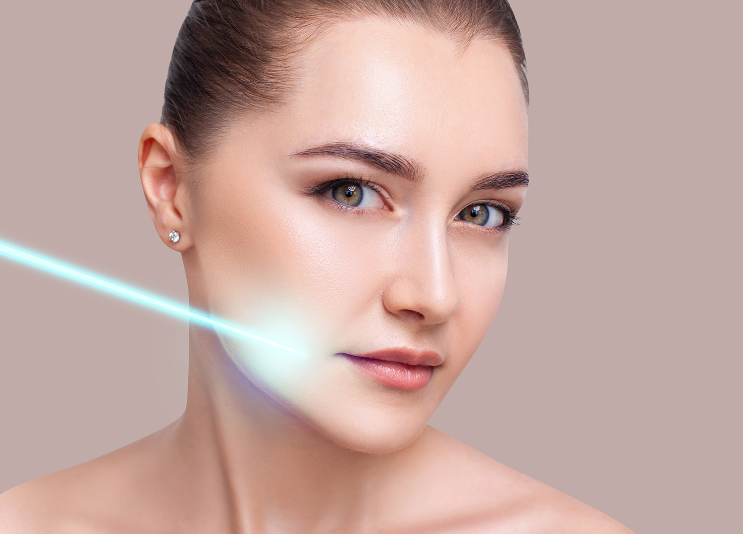 Cosmetics laser ray on beautiful female face