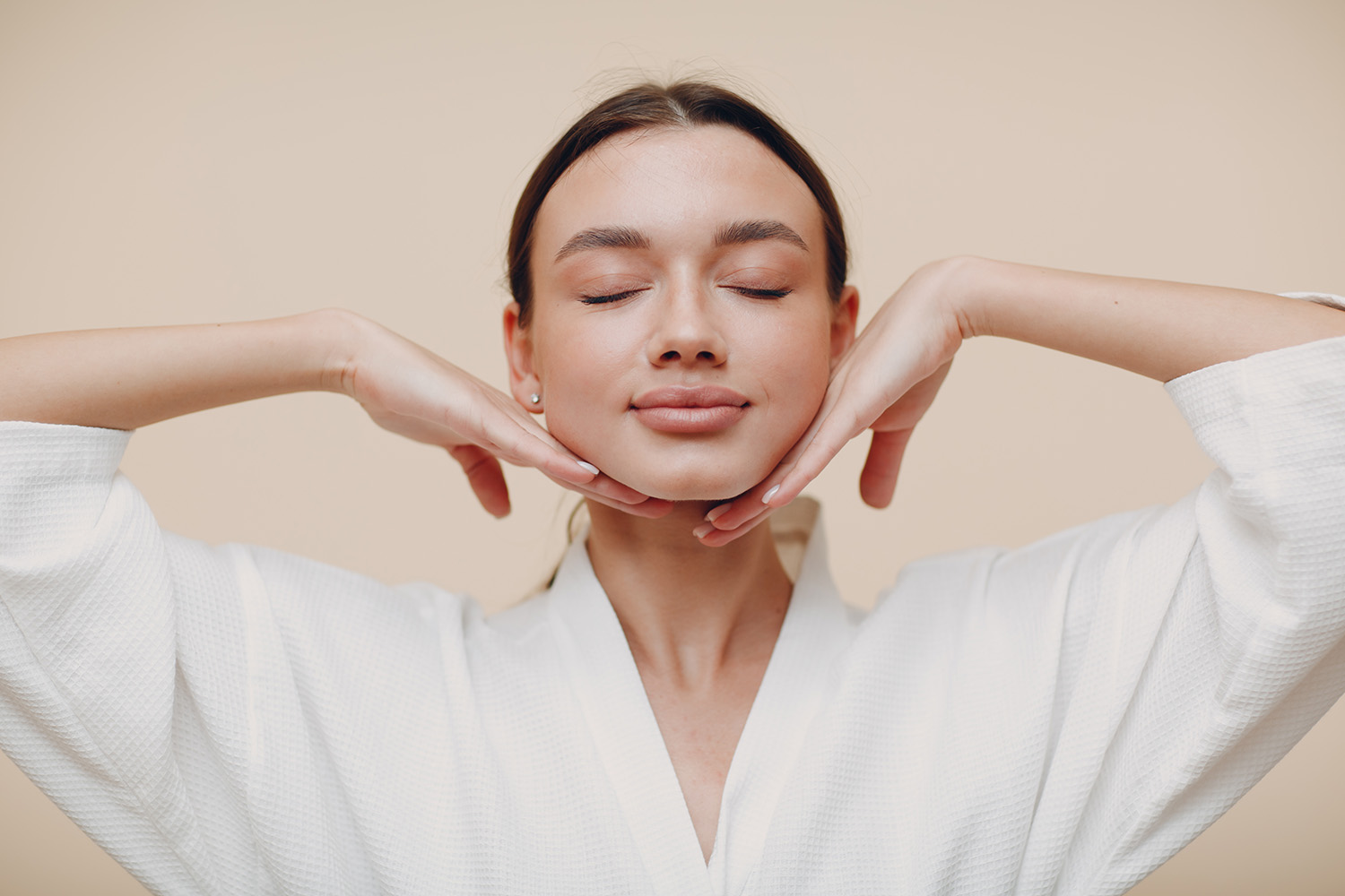 Young woman doing face building yoga facial gymnastics self massage