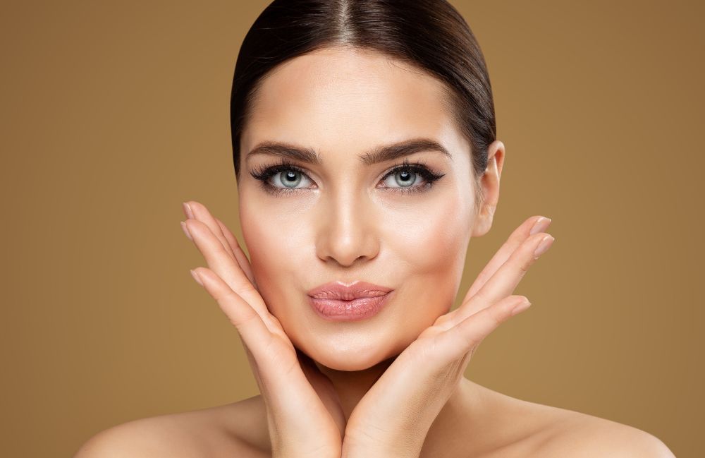 A woman receiving a relaxing Diamond Glow facial treatment.