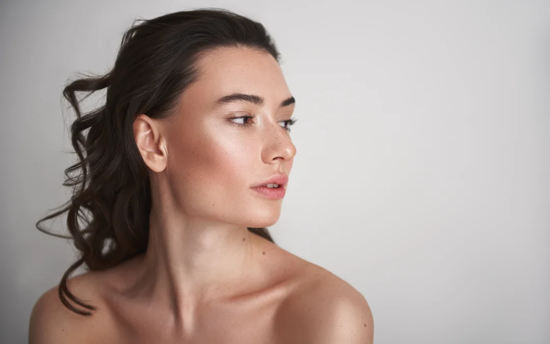 A woman with radiant skin looking sideways, highlighting the benefits of PRP for skin rejuvenation.