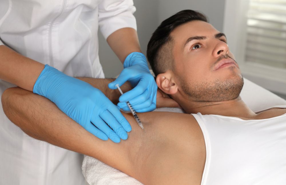 excessive-sweating-botox-treatment Side-by-side comparison of a woman's neck before and after platysmal band injections.