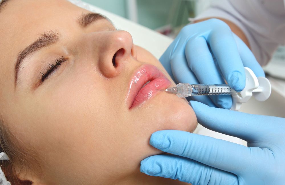 ha_filler_procedure Side-by-side comparison of a woman's neck before and after platysmal band injections.