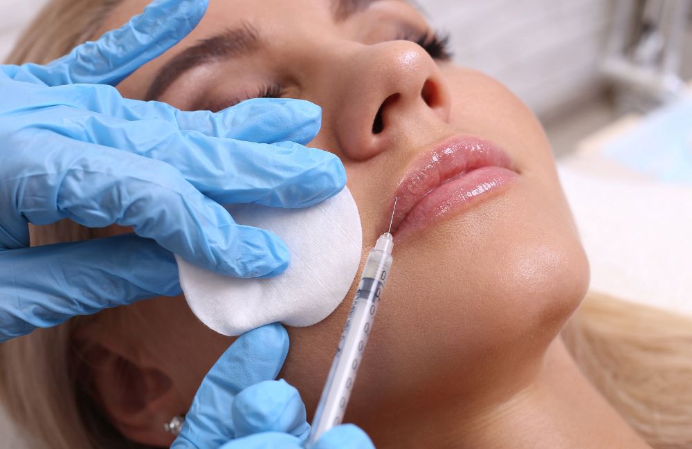 lip_filler_medspa_session Side-by-side comparison of a woman's neck before and after platysmal band injections.