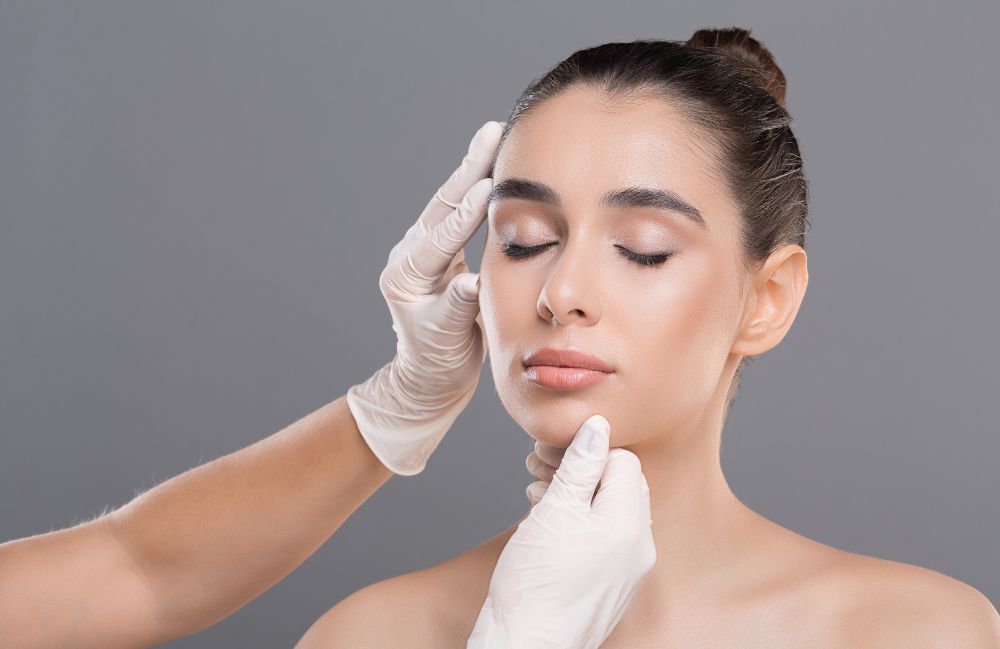 liquid_rhinoplasty Close-up of a woman's neck showing visible platysmal bands before treatment.