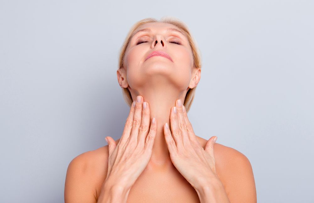 neck-tightening-firm-skin-after Close-up of a woman's neck showing visible platysmal bands before treatment.