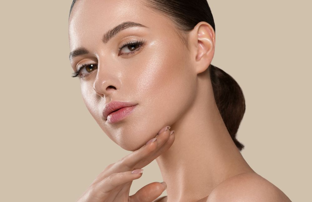 sculptra_beauty Close-up of a woman's neck showing visible platysmal bands before treatment.