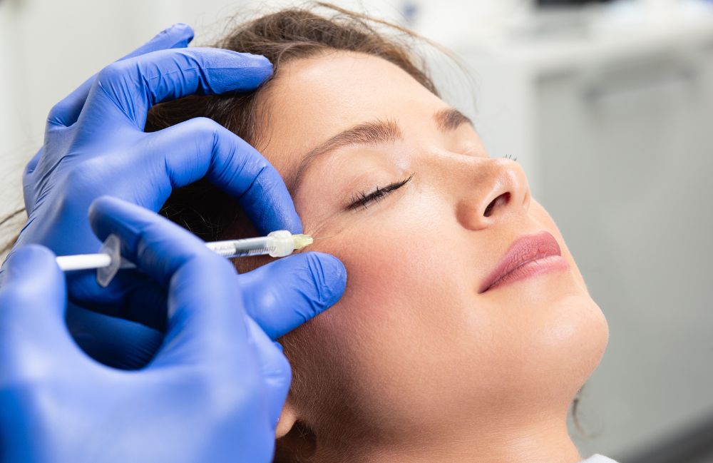 sculptra_session_medspa Side-by-side comparison of a woman's neck before and after platysmal band injections.